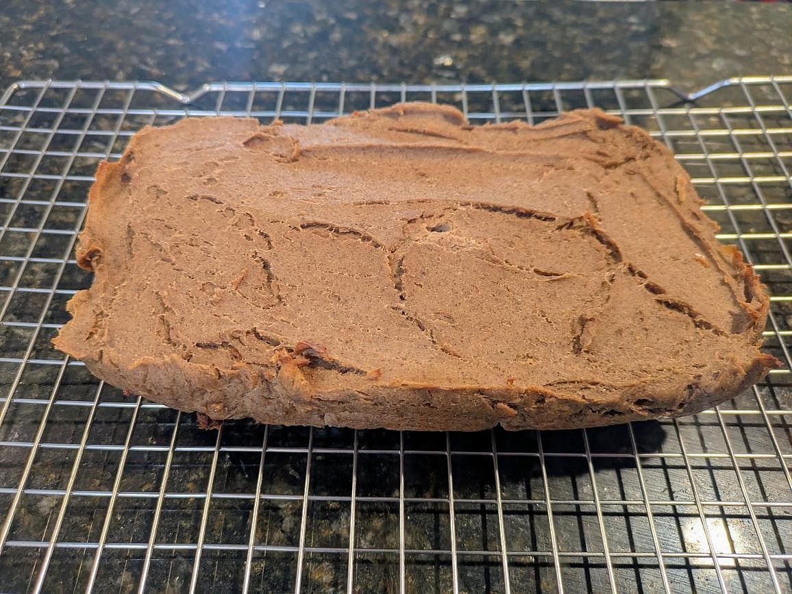 Allow it to cool completely (at least 1 hour in the fridge on a wire rack) before slicing.