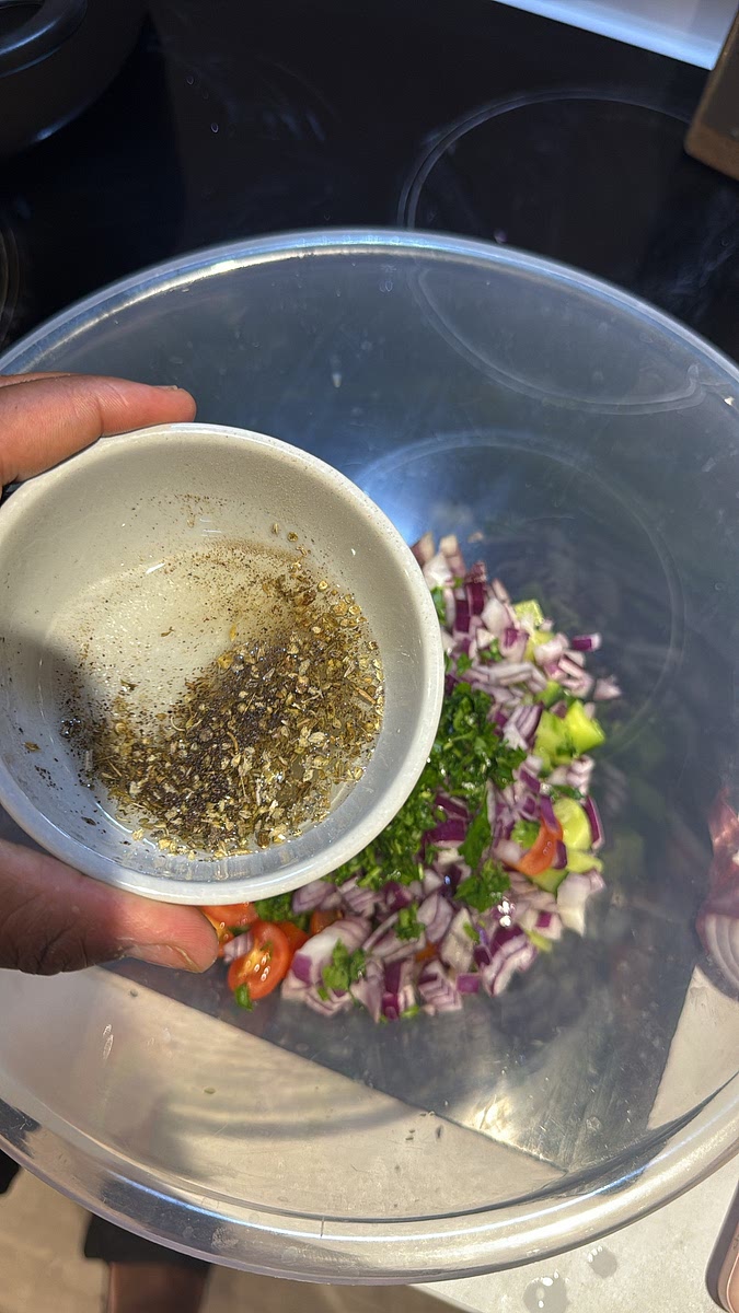 In a separate bowl, add together the olive oil, lemon juice, dried oregano, salt and black pepper.