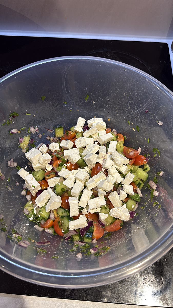 Pour the dressing over the salad and toss gently. Crumble the feta cheese over the top.