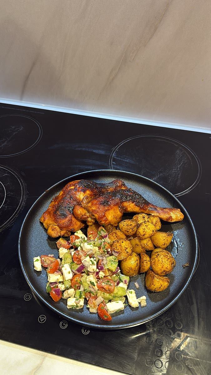 Plate the sticky honey harissa chicken alongside the crispy garlic herb potatoes and Mediterranean feta salad.