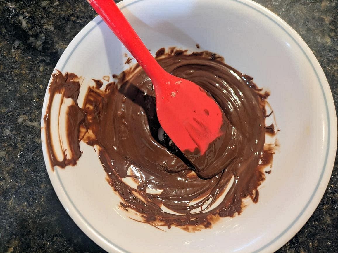 Add chocolate chips and coconut oil to a small microwave safe bowl. Microwave in 20 second intervals, stirring in between, until you have a smooth melted chocolate.