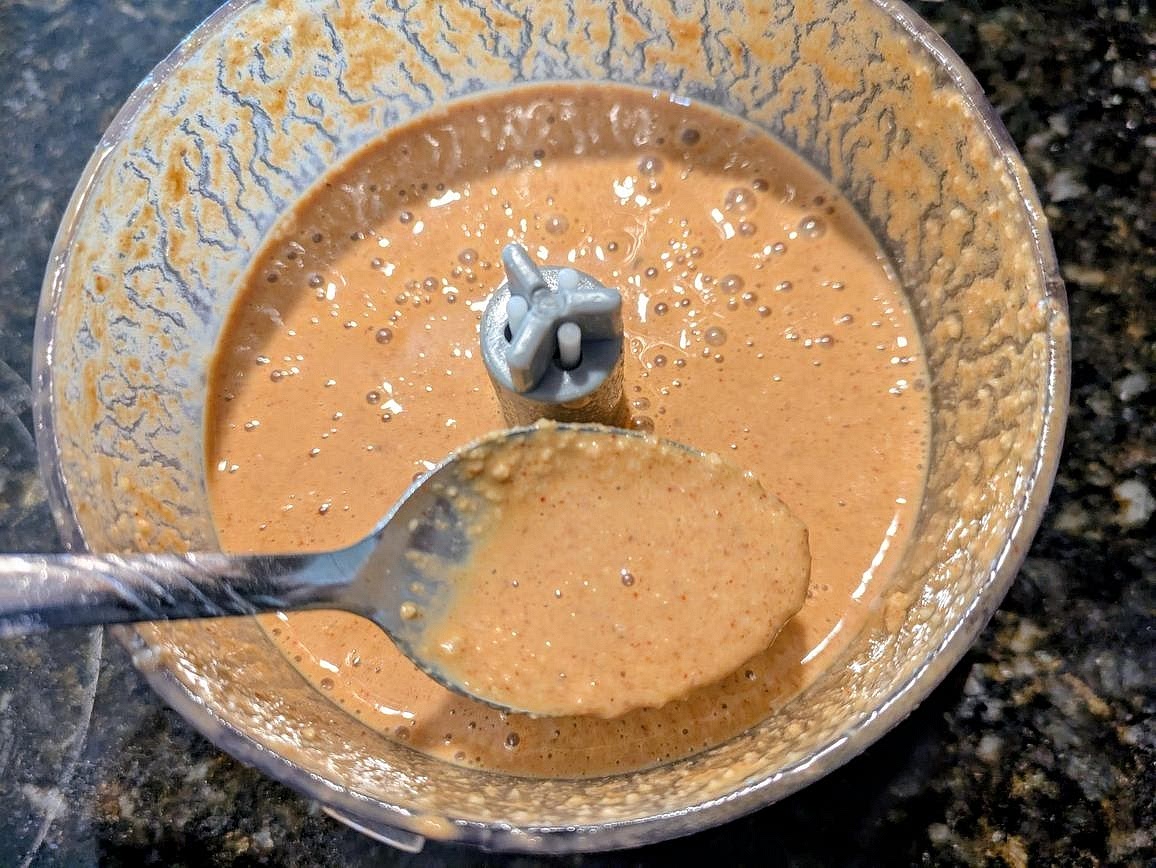 Blend together walnuts, lime juice, mustard, minced garlic, liquid monk fruit, salt, paprika, garlic powder, cumin, and cayenne pepper in a small blender or food processor. Thin out with water as needed.