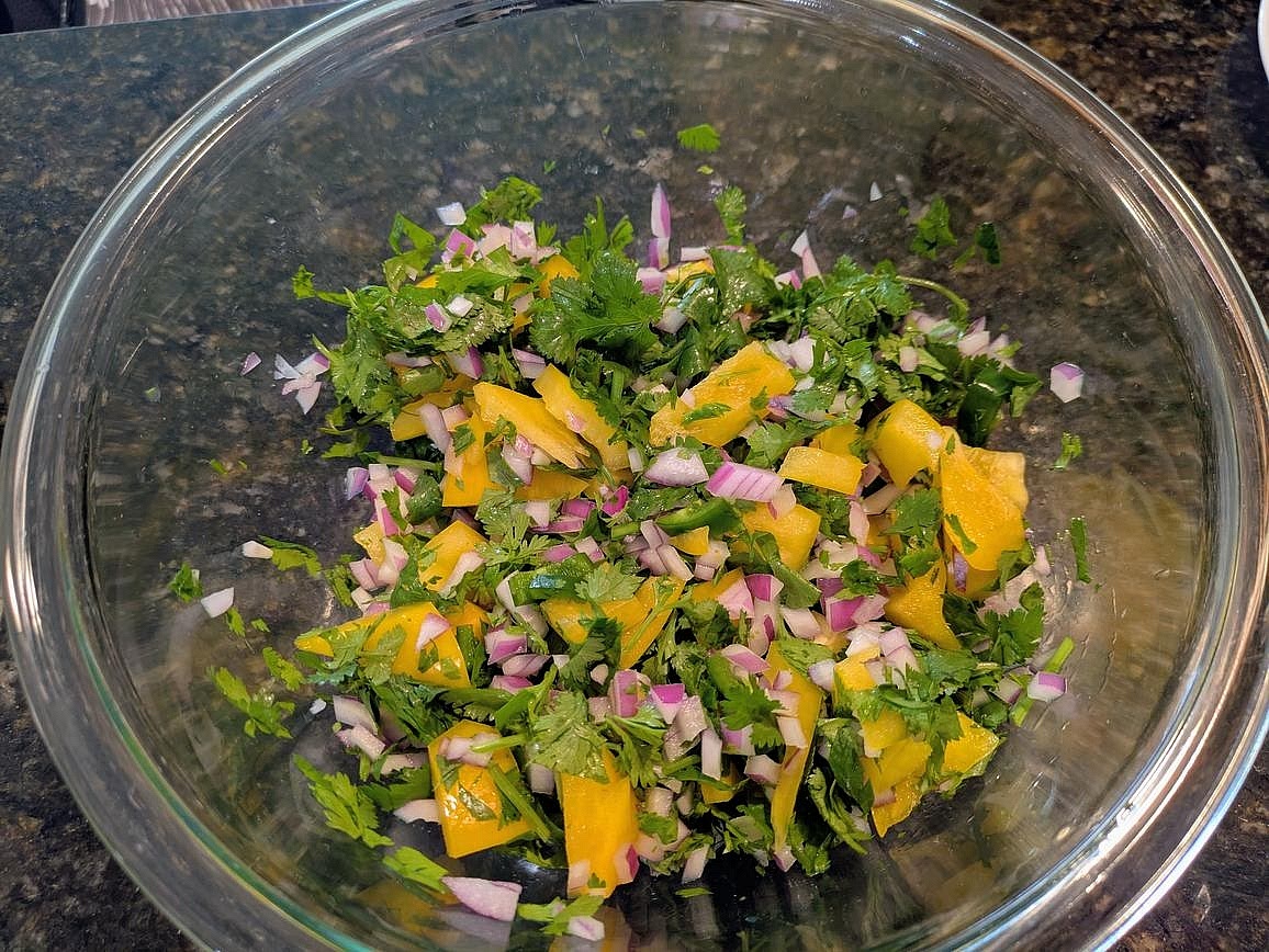 Drain and rinse your beans, and add to a large bowl. Cut your pepper and onion into a medium dice, and the jalapeno into a small dice. Roughly chop your cilantro, and mix into the veggies and beans.