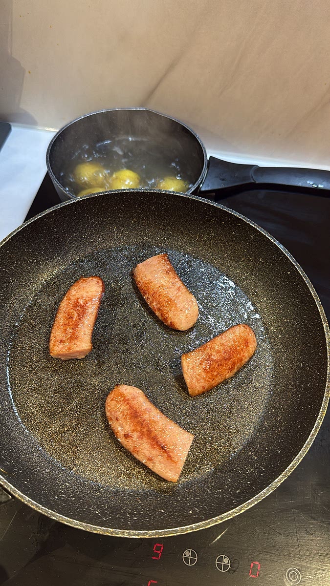 Add the sliced smoked sausage and fry for 3–4 minutes, turning occasionally, until beautifully browned around the edges.