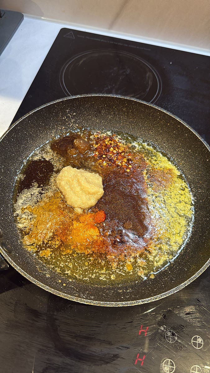 Reduce the heat to medium-low. Add the butter to the same pan. Once melted, add the minced garlic, Creole seasoning, Old Bay, smoked paprika, garlic powder, onion powder, black pepper, chilli flakes and brown sugar soy sauce and lemon juice