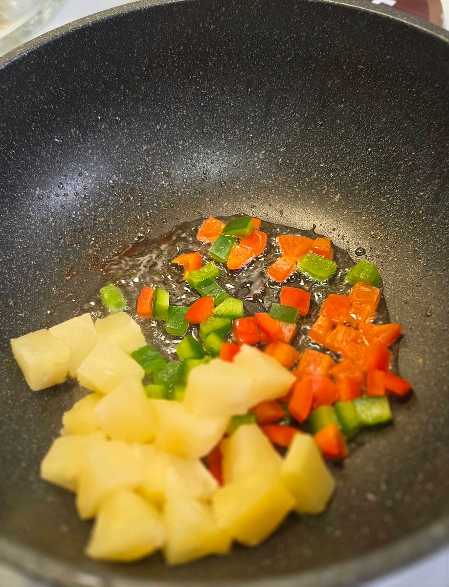 Add bell peppers and pineapple chucks sauté until slightly tender. Set aside with chicken.