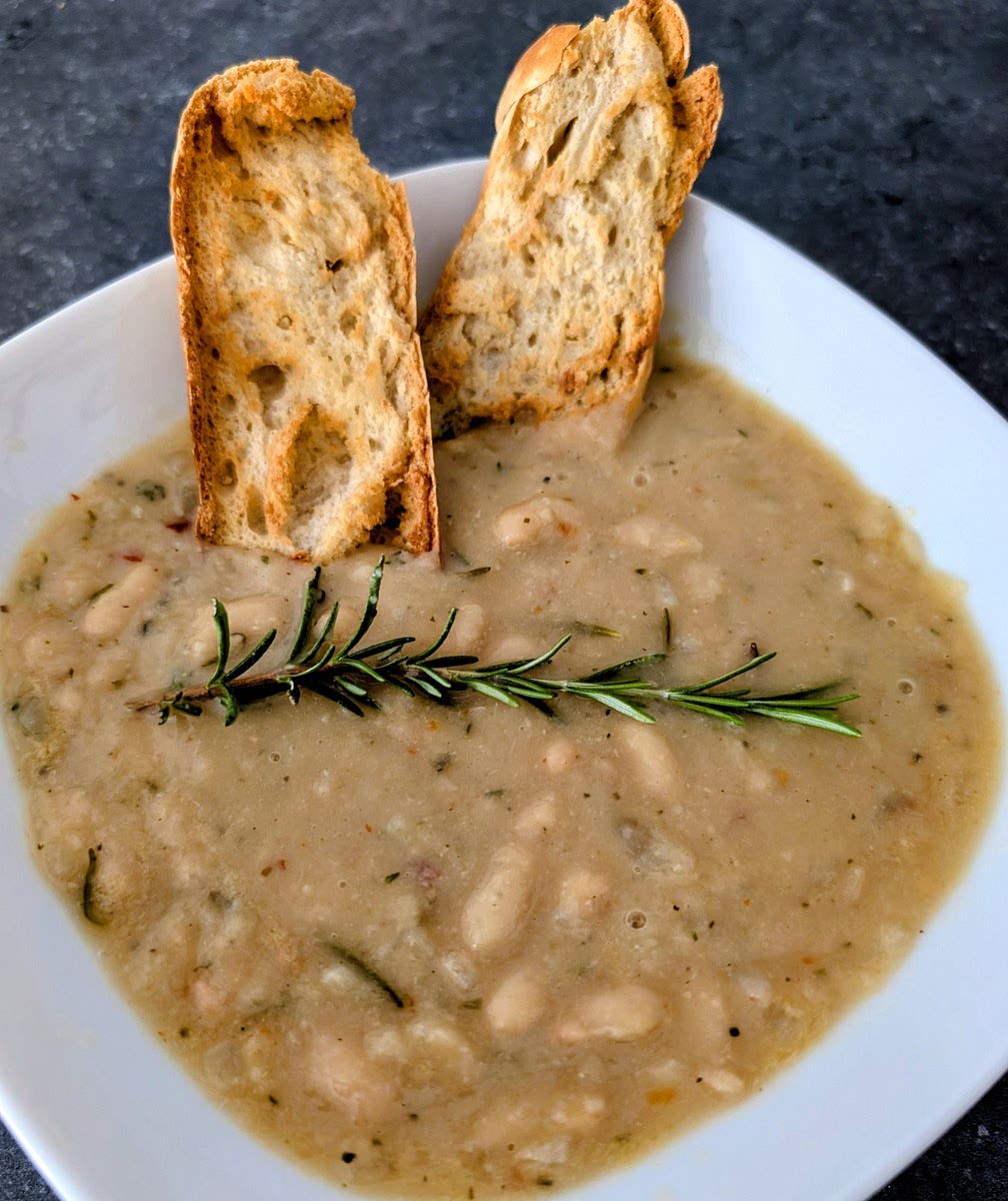 Serve with home made flatbread or garlic toast, and garnish with the remaining sprig of rosemary. Enjoy!
