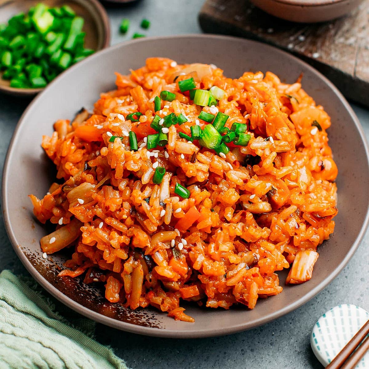 Make this kimchi fried rice: https://fullofplants.com/kimchi-fried-rice/ Sausage is optional in that recipe, and I recommend not adding any (cause we're gonna add sausage in the roll later) and also to chop the veggies really small so your roll doesn't fall apart easily.