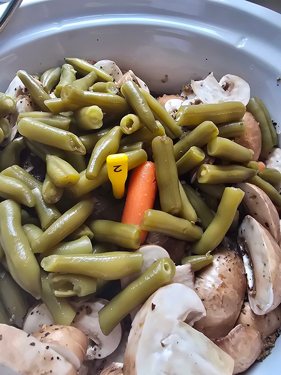 Add carrots, mushrooms, and green beans.