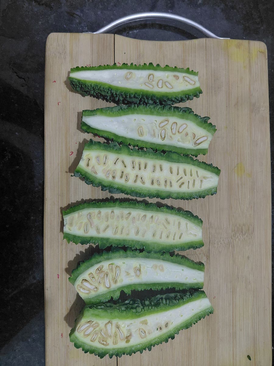 Cut 6 medium size Karela vertically in two halves.