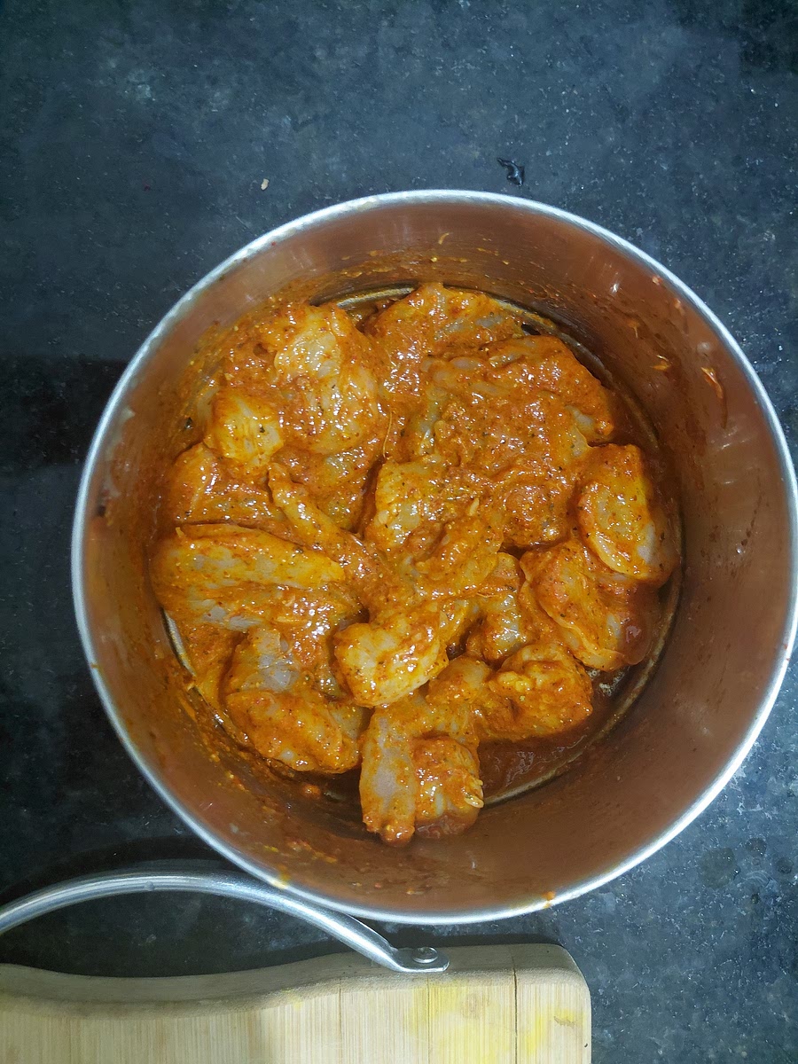 Marinate 200 gm prawns with:
1. Juice of one lime or 1 tablespoon lemon juice.
2. 1/2 teaspoon Salt.
3. 1 tablespoon Ginger Garlic Paste.
4. 1/2 teaspoon Black Pepper Powder.
5. 1 teaspoon Red Chilli Powder.
4. 1/2 teaspoon Turmerric.
6. 1 and 1/2 teaspoon Kashmiri Red Chilli Powder. Set aside for atleast one hour.