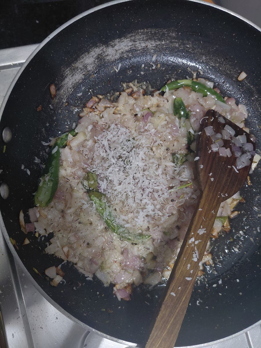 Once the onions are soft add 1/2 teaspoon of khobra.