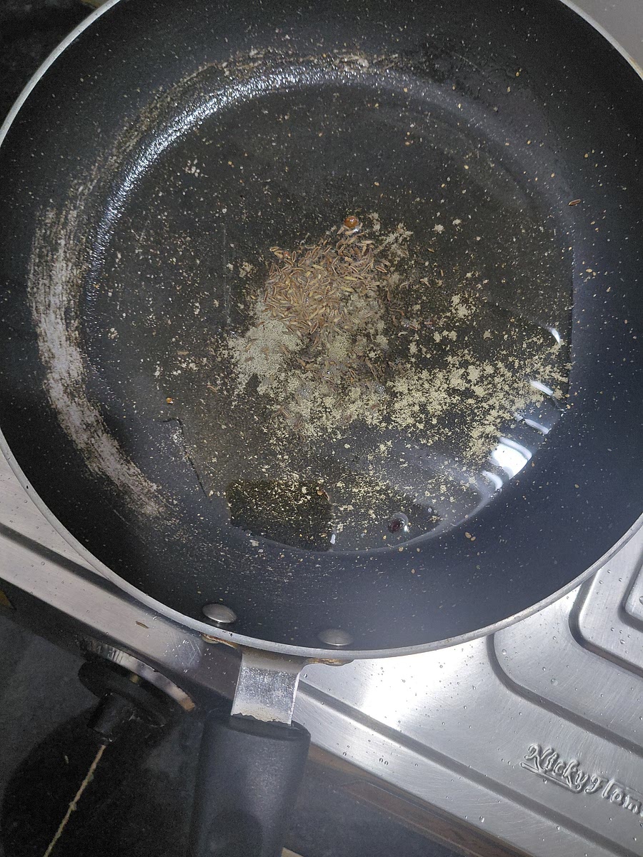 Heat 2 tablespoons of oil. Add 1 teaspoon of cumin seeds and wait till they splutter.