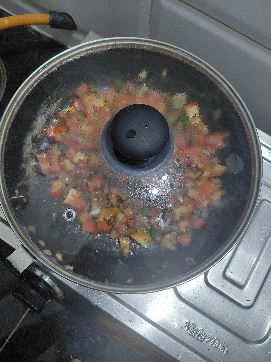Cover and cook till tomatoes soften.
