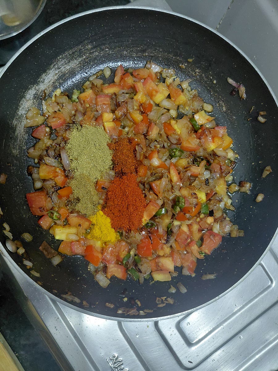Add 1/2 teaspoon of red chilli powder and cumin powder. 1 teaspoon of turmeric powder. 1 & 1/2 teaspoons of corriender and kashmiri red chilli powder.