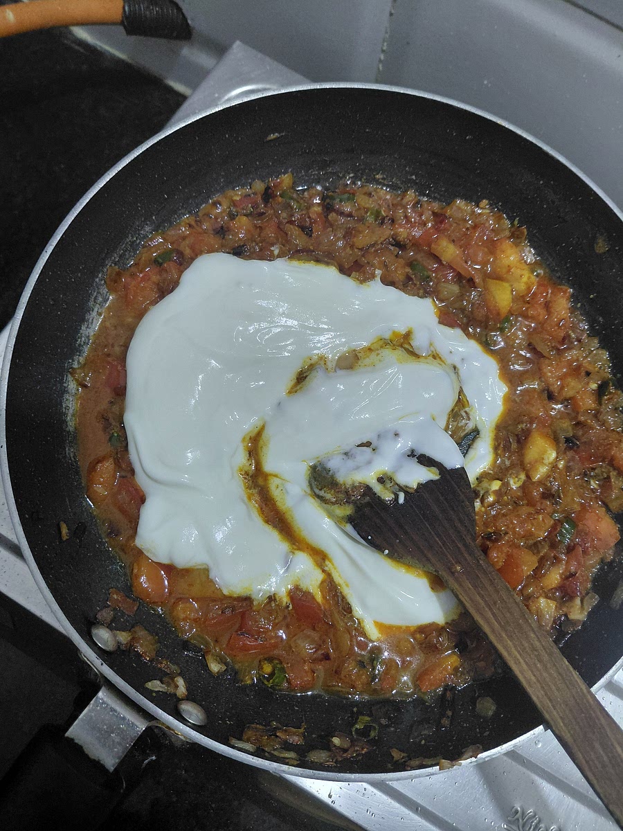 Add one small bowl of whipped dahi, increase the flame and stir continuously so that it does not split.