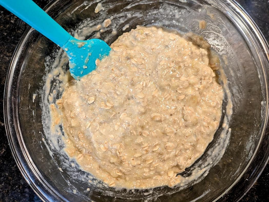 Pour the wet ingredients into the dry, and mix until just fully combined with a silicone spatula.