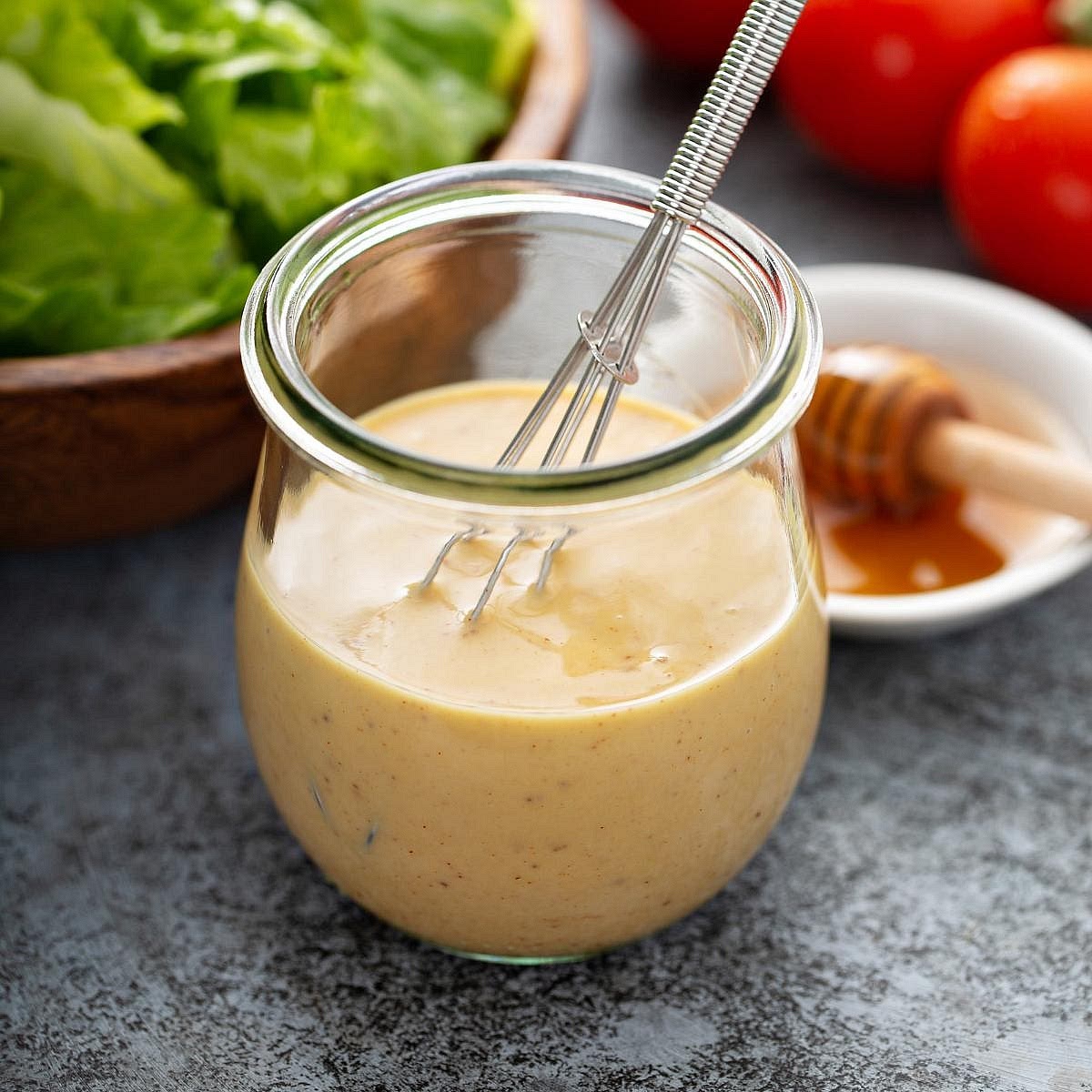 Make the dressing. Whisk the Dijon mustard, mayonnaise, honey and lemon juice together. Add water gradually until creamy and pourable. Taste and adjust the sweetness or mustard.
