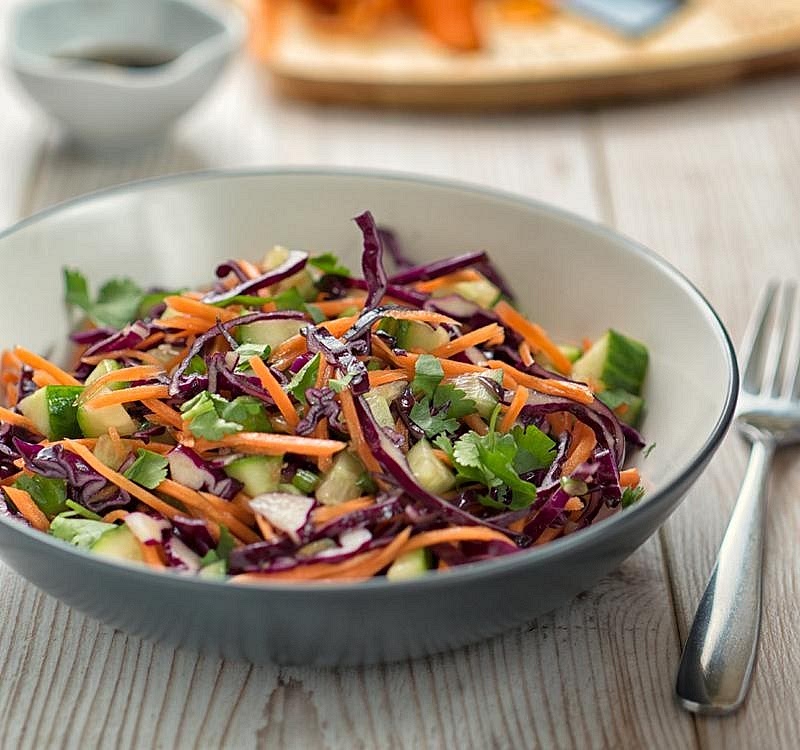 Prepare the crunchy slaw. Combine shredded cabbage, grated carrot and diced cucumber. Toss with the lemon or lime juice and olive oil. Season lightly. Keep the dressing simple so the tanginess cuts through the rich, smoky BBQ sauce.