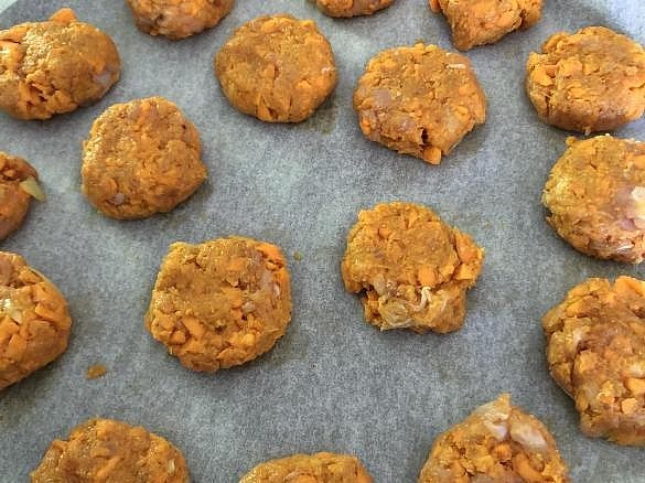 Shape and bake the nuggets Line a second baking tray with parchment paper. Using a tablespoon, scoop out the mixture and form small nugget shapes with slightly wet hands. Your two-serving batch should make approximately 9–11 small nuggets. The 18–21 nugget yield in Molly's instructions applies to the full four-serving recipe, before scaling. Bake for 18–20 minutes, turning halfway, until the centre reaches 74°C. For a more golden exterior, broil for the final 1–2 minutes, watching closely. These nuggets remain tender inside rather than having the crunch of breadcrumb-coated nuggets.