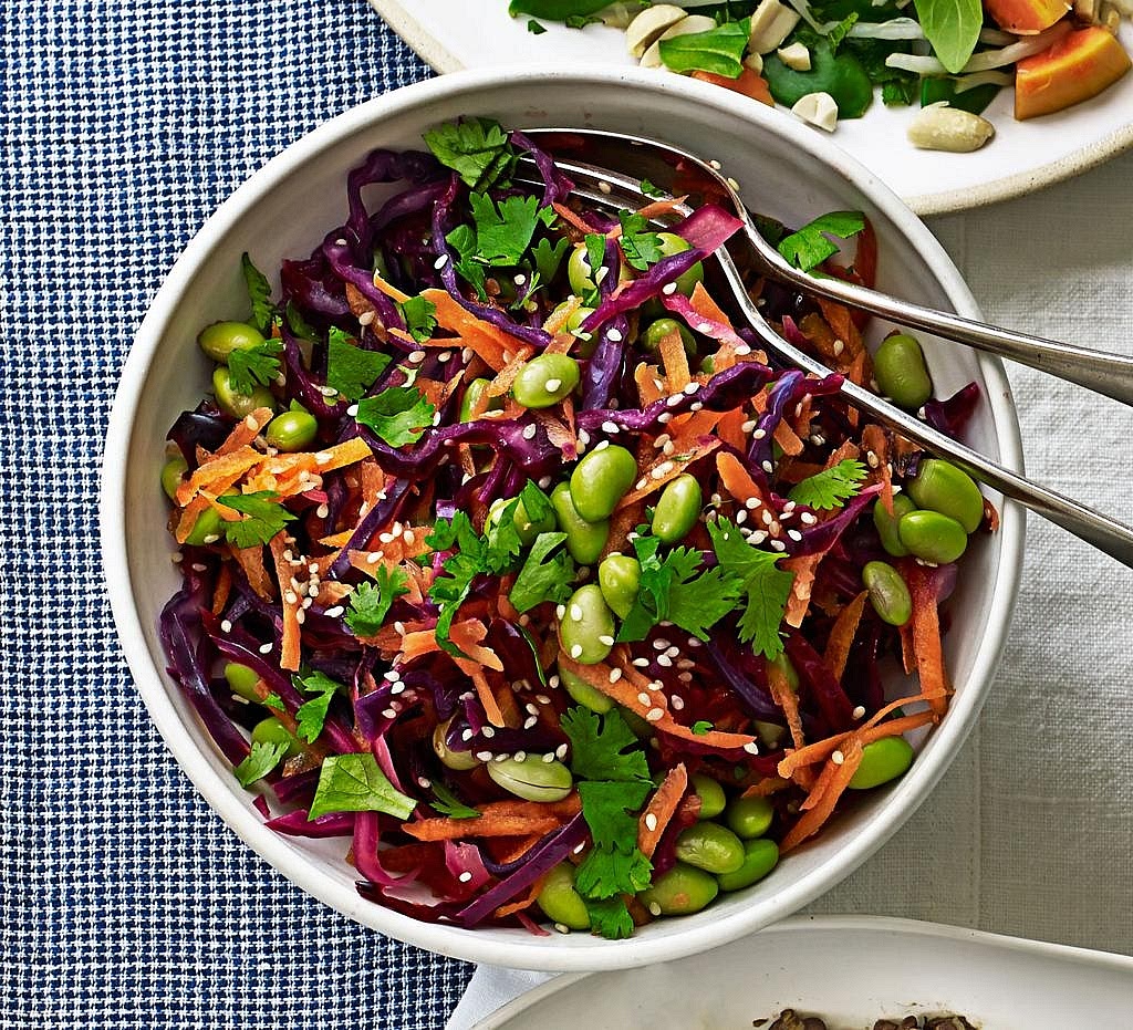 Make the crunchy rainbow slaw Combine the shredded cabbage, julienned cucumber, grated carrot, cooked edamame and sliced spring onions. Toss with fresh lime juice and a little black pepper. Keep the slaw chilled until serving. The crisp vegetables help balance the warm, sticky glaze.