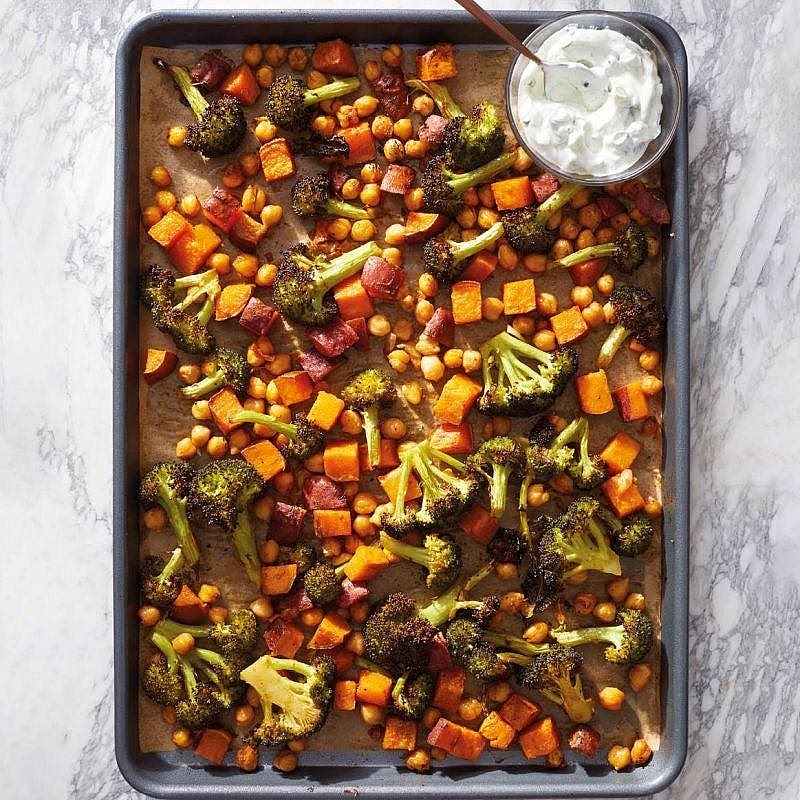 Roast the vegetables and chickpeas Pat the drained chickpeas dry. Toss the chickpeas and sliced carrots with some of the olive oil, salt and pepper. Place on a second baking tray approximately 20–25 minutes before the potatoes finish. Add the broccoli and remaining oil for the last 15–18 minutes. Roast until the carrots are tender, the broccoli has browned edges and the chickpeas are lightly crisp. Finish with fresh lemon juice.
