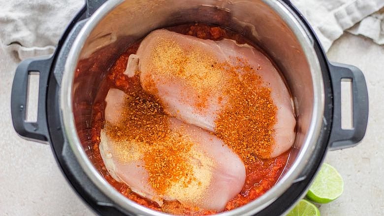 Prepare the salsa chicken Season the chicken breasts lightly with salt and pepper. Pour the chicken broth into the Instant Pot. Add the chicken and sprinkle with taco seasoning. Spoon the tomato salsa over the chicken. Avoid stirring thick salsa into the bottom, where it may scorch during pressure cooking.