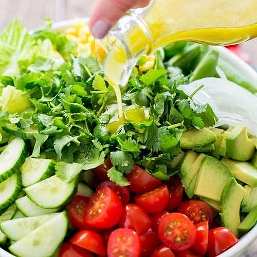 Prepare the fresh Mexican lime salad Combine shredded romaine lettuce, chopped cucumber, halved cherry tomatoes and coriander. Toss with fresh lime juice shortly before serving. This cool, crunchy salad complements the warm, smoky casserole without competing with the enchilada spices.