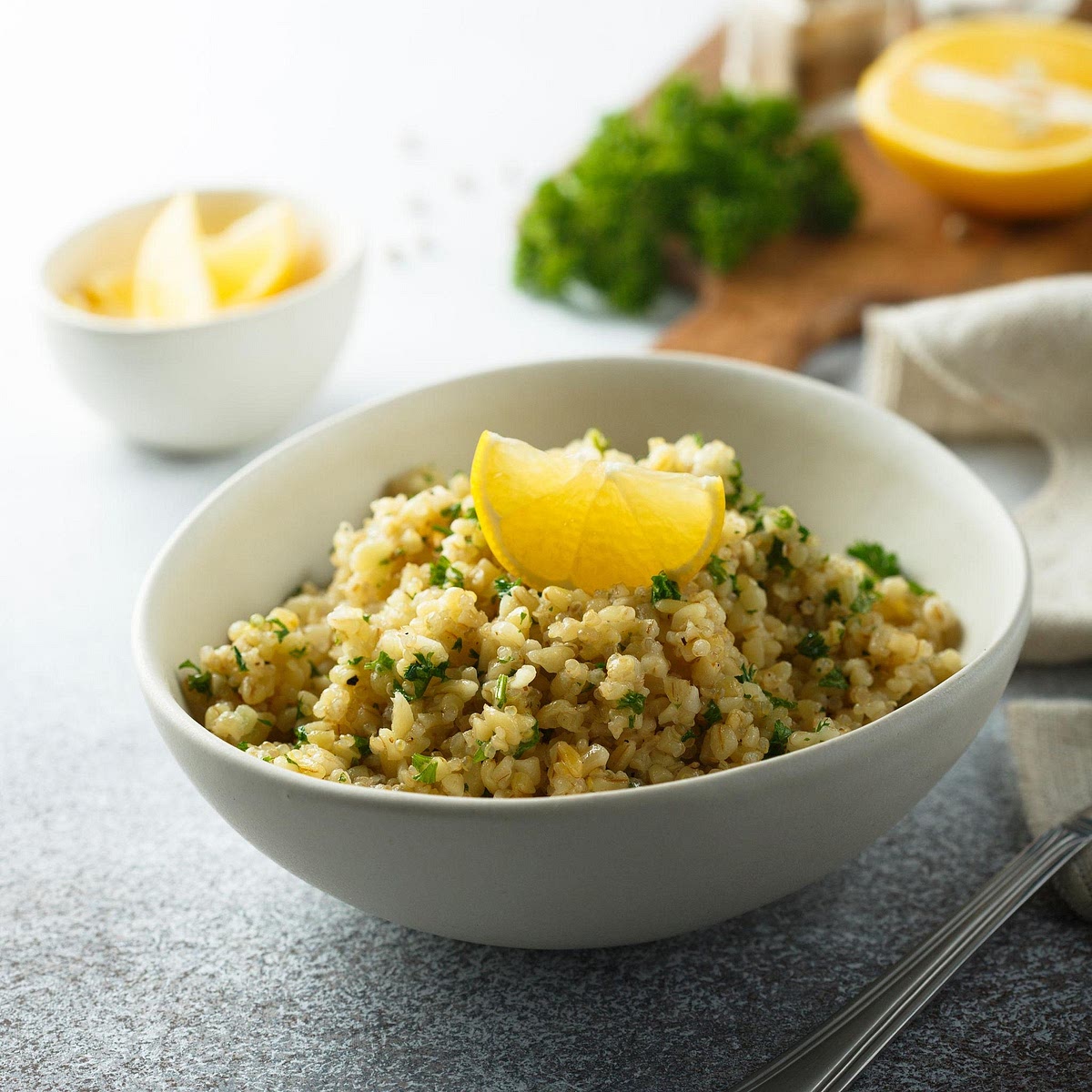 Prepare the lemon-herb quinoa Rinse the dry quinoa thoroughly under cold running water. Add to a saucepan with 200 ml water and a pinch of salt. Bring to a boil, cover and simmer over low heat for approximately 12–15 minutes, until tender and the liquid has been absorbed. Rest covered for 5 minutes, then fluff with a fork. Stir in the lemon juice and chopped parsley. Allow to cool slightly before serving.