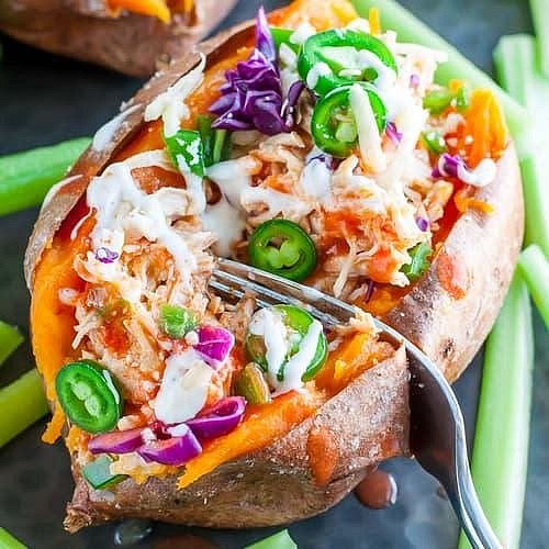 Assemble your balanced dinner Serve two stuffed sweet potato halves per person, or one whole sweet potato divided into halves. Add a generous serving of crunchy chickpea rainbow slaw alongside. Finish with fresh parsley or chives and, if desired, an extra drizzle of buffalo sauce.