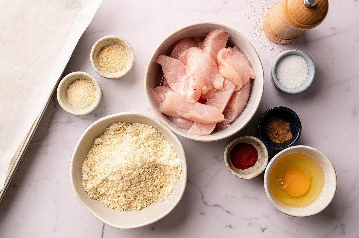 Prepare the almond coating In one shallow bowl, combine almond flour, tapioca flour, smoked paprika, onion powder, garlic powder, salt and black pepper. Beat the egg in a second bowl. Pat the chicken thighs dry, then dip each thigh into the egg followed by the almond flour mixture. Press the coating gently onto the chicken so it adheres evenly.