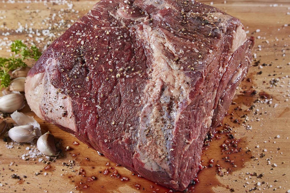 Prepare and season the beef Pat the beef chuck roast dry with paper towels. Trim off large, firm pieces of external fat, leaving some marbling for tenderness. Season all sides with garlic powder, onion powder, salt and black pepper. Leave the roast whole if it fits comfortably into the Instant Pot. If unusually thick, cut it into two similarly sized pieces to encourage even cooking.