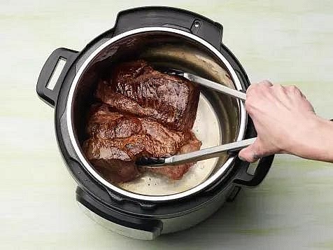 Sear the pot roast Set the Instant Pot to Sauté and add two teaspoons of olive oil. Once hot, add the seasoned beef and sear for approximately 3–4 minutes per side until it develops a rich, browned crust. Remove the beef to a plate. Add the diced onion and sauté for 2–3 minutes. Stir in the garlic for another 30 seconds.