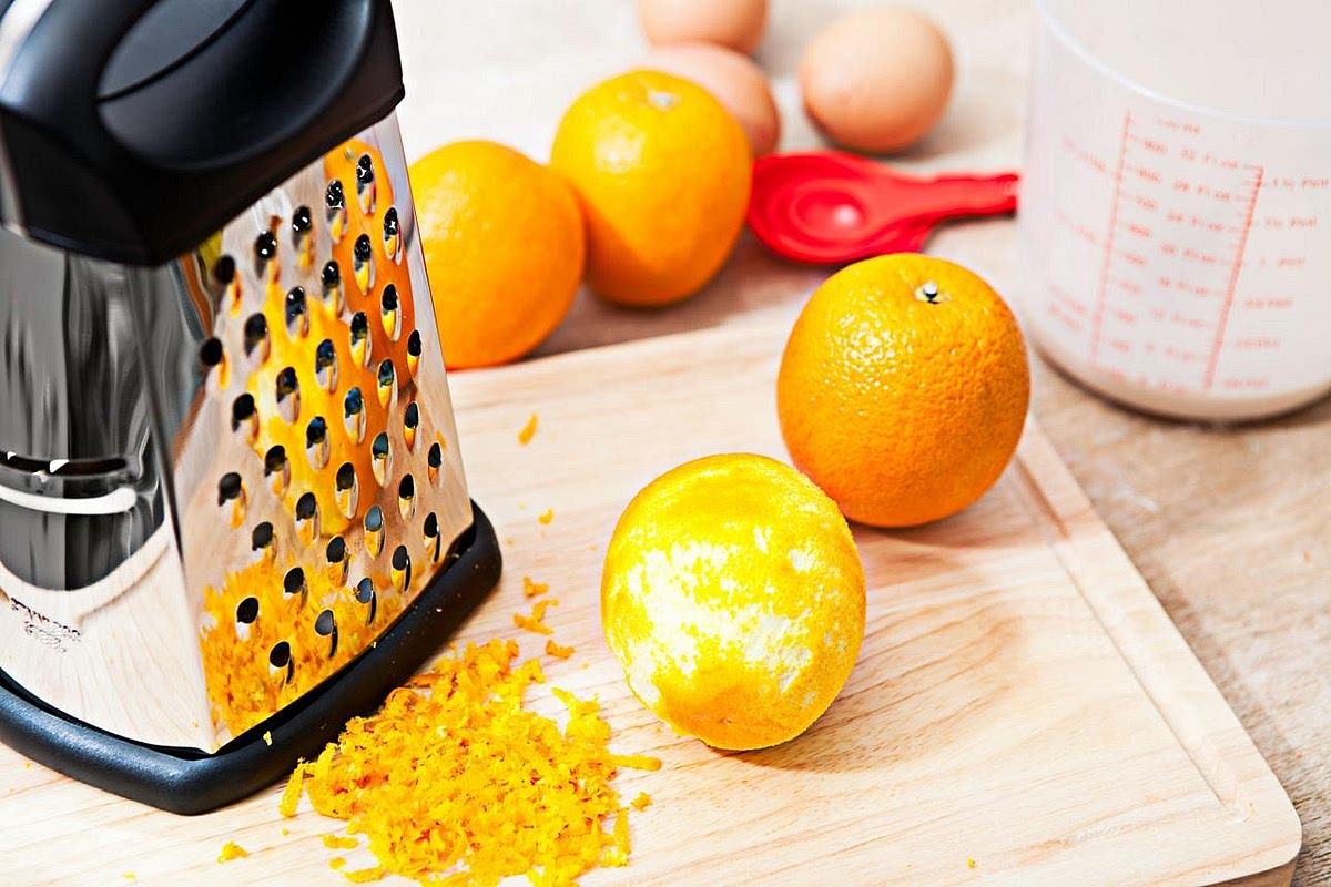 Wash the orange thoroughly and finely grate the zest, avoiding the white pith, which can taste bitter. Squeeze the orange and measure out 100 ml of juice.