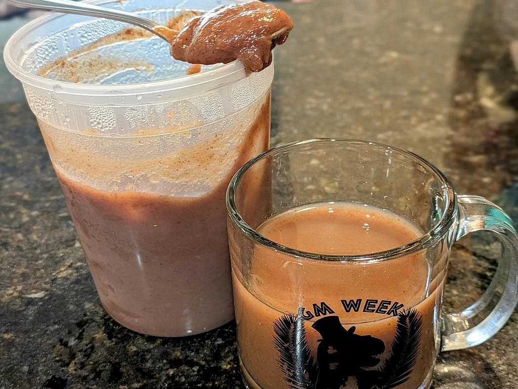Whisk together apple spread and water in a large bowl. Pour into a medium glass or mug.