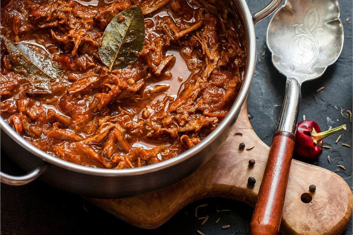 Slow cook the beef ragu Add the crushed tomatoes, remaining beef stock, fresh thyme and bay leaf to the slow cooker. Stir gently to combine, ensuring the beef is mostly surrounded by sauce. Cover and cook on LOW for approximately 8–10 hours, until the beef is tender enough to shred easily. Begin checking around 7–8 hours for these smaller pieces. If the beef remains firm, continue cooking until it softens. For an even richer sauce, allow the tomato mixture to slowly reduce around the beef. Avoid adding excess liquid unnecessarily.