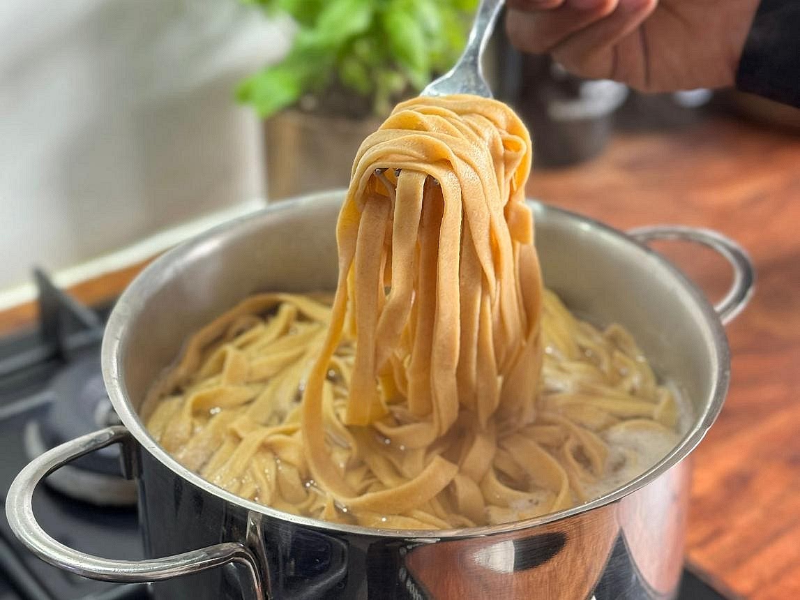 Cook the gluten-free pasta Bring a large saucepan of lightly salted water to a boil. Cook the gluten-free pappardelle or tagliatelle according to its package directions until al dente. Reserve a little pasta cooking water, then drain. Gently toss the pasta with some of the beef ragu, adding a splash of reserved pasta water if necessary to help the sauce coat the ribbons. Avoid overcooking gluten-free pasta, which can break apart more easily than wheat pasta.