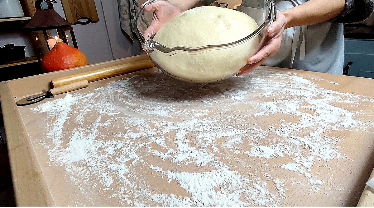 Once the dough has doubled in size, check if it's ready. Gently press a floured finger into the dough. If it springs back and remains slightly visible, the dough is likely ready. If it springs back quickly, cover and let it rise a little longer. If the indentation stays and doesn't spring back, the dough may be fully proofed or overproofed.