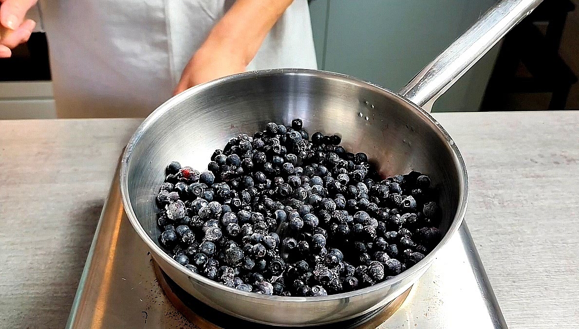Add the blueberries to a cold saucepan and place over medium heat
