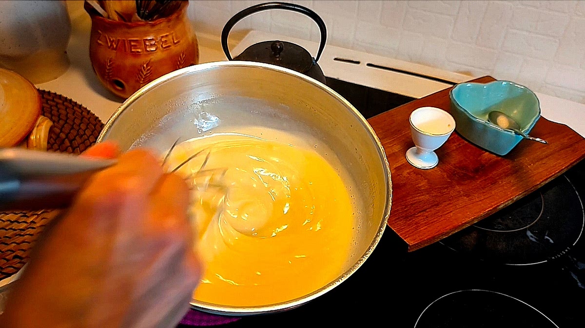 Once the butter and sugar have melted, whisk a little warm milk from the saucer into the slurry until smooth. Pour it back into the pan, whisking until the sauce starts to thicken, then remove from the heat. Add the vanilla and continue stirring until smooth and thickened.